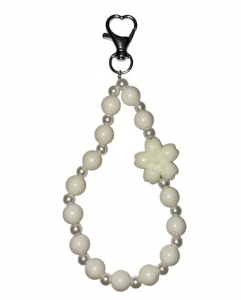 White faux pearl beaded phone charm with a white flower accent and heart-shaped metal clasp.